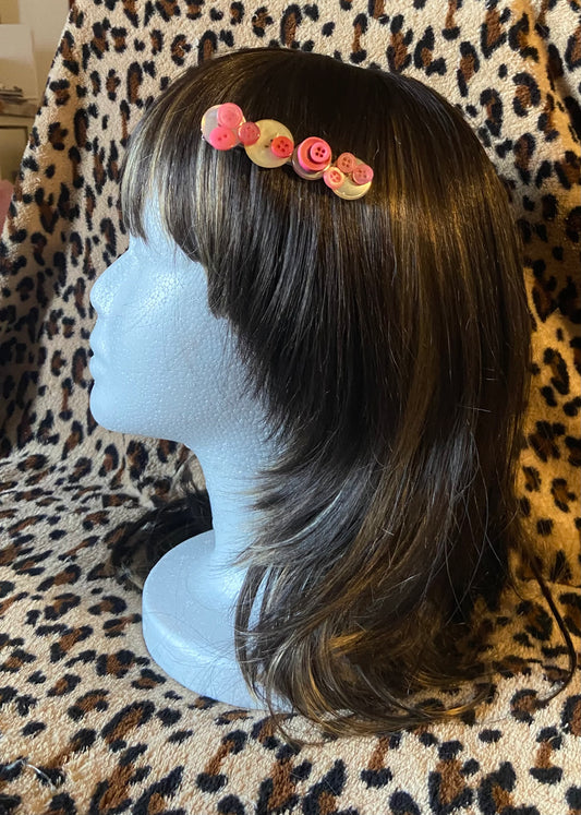 Barrette à boutons blanc et rose