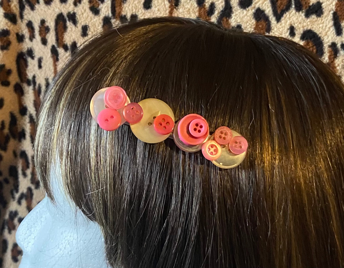 Barrette à boutons blanc et rose